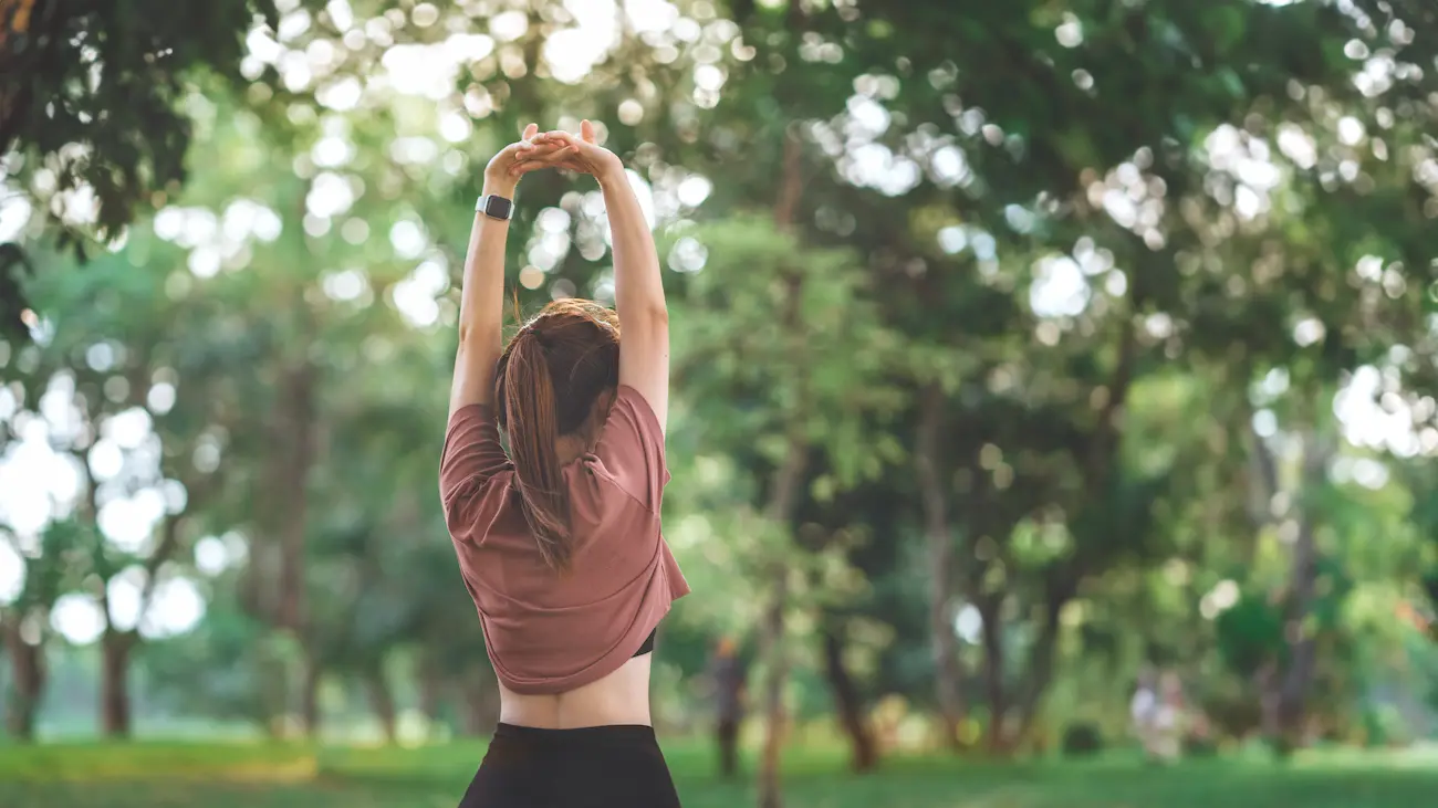 a woman stretching wondering why does stretching feel good