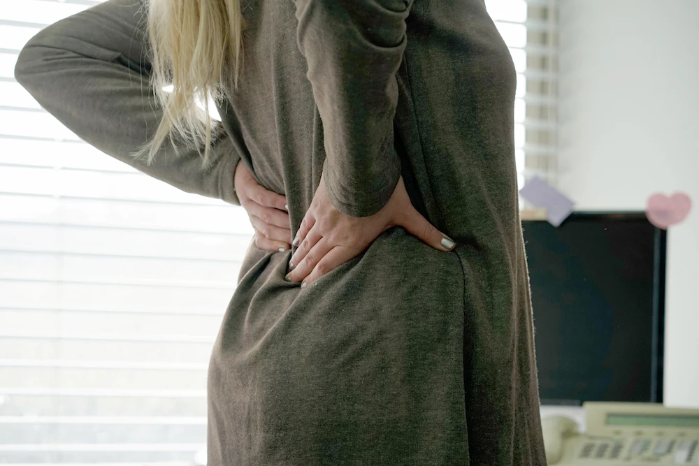 back-and-body-hurts A woman with back and body hurts