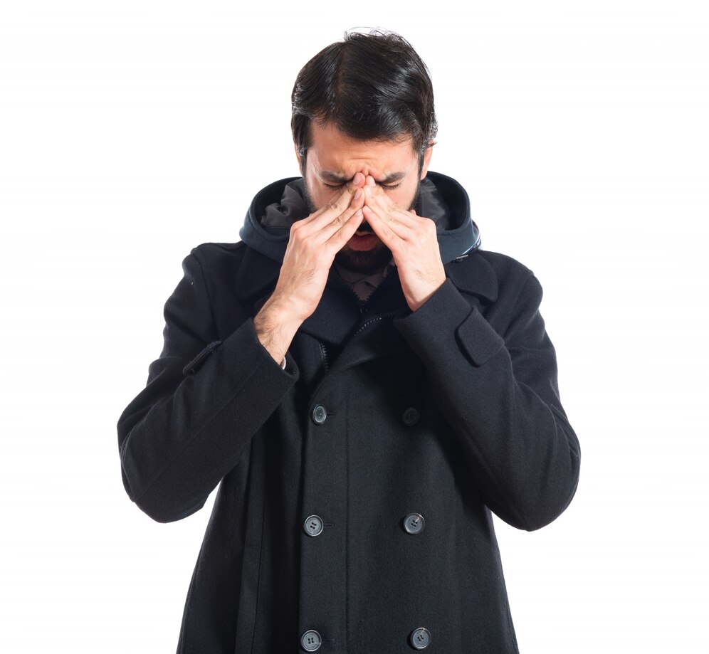 man pressing his nose making it harder to breathe through nose but no mucus