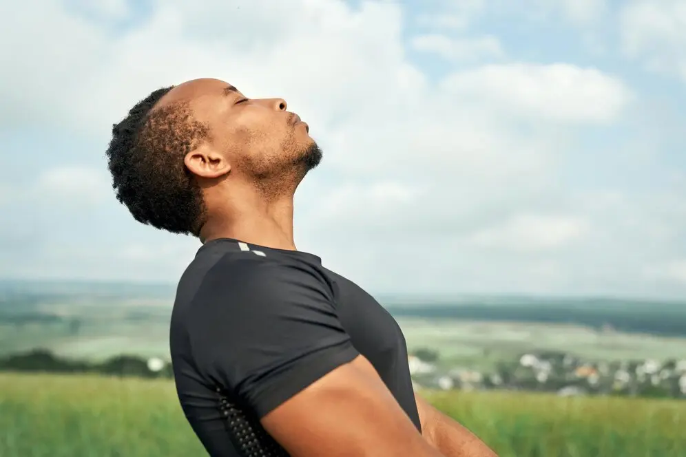 a man attempting to breathe to increase his oxygen level immediately in miami