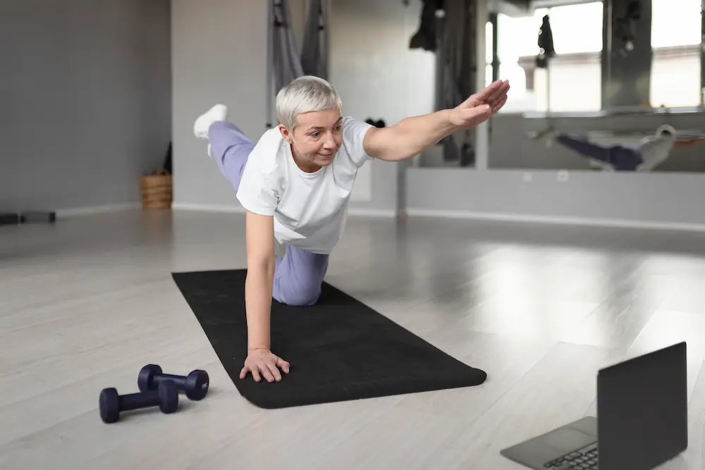 a women over 60 doing mobility exercises