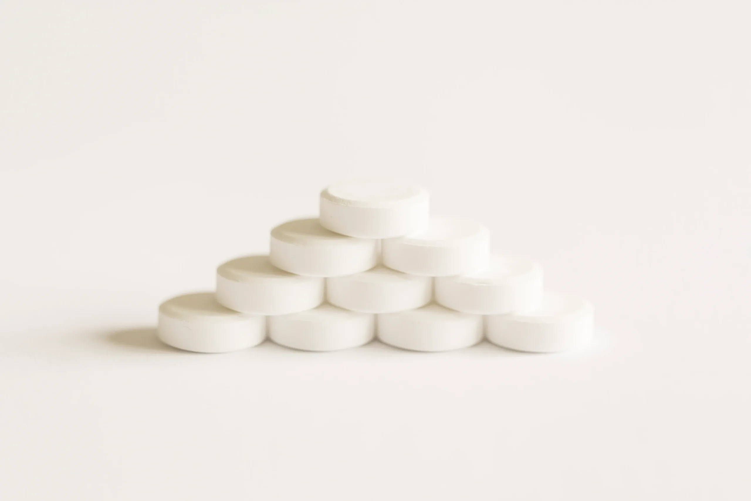 a stack of short-term prednisone tablets in a pyramid