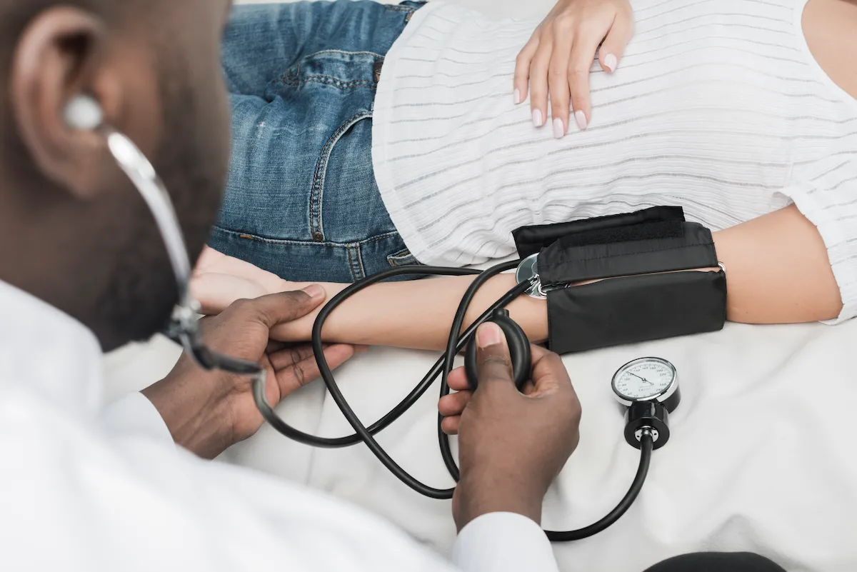 a doctor administering a new blood pressure treatment