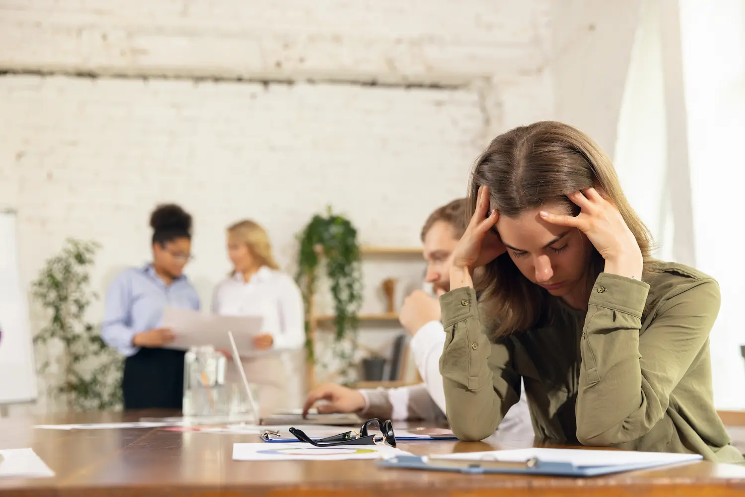 a woman with a stress headache wondering what the normal cortisol levels by age are