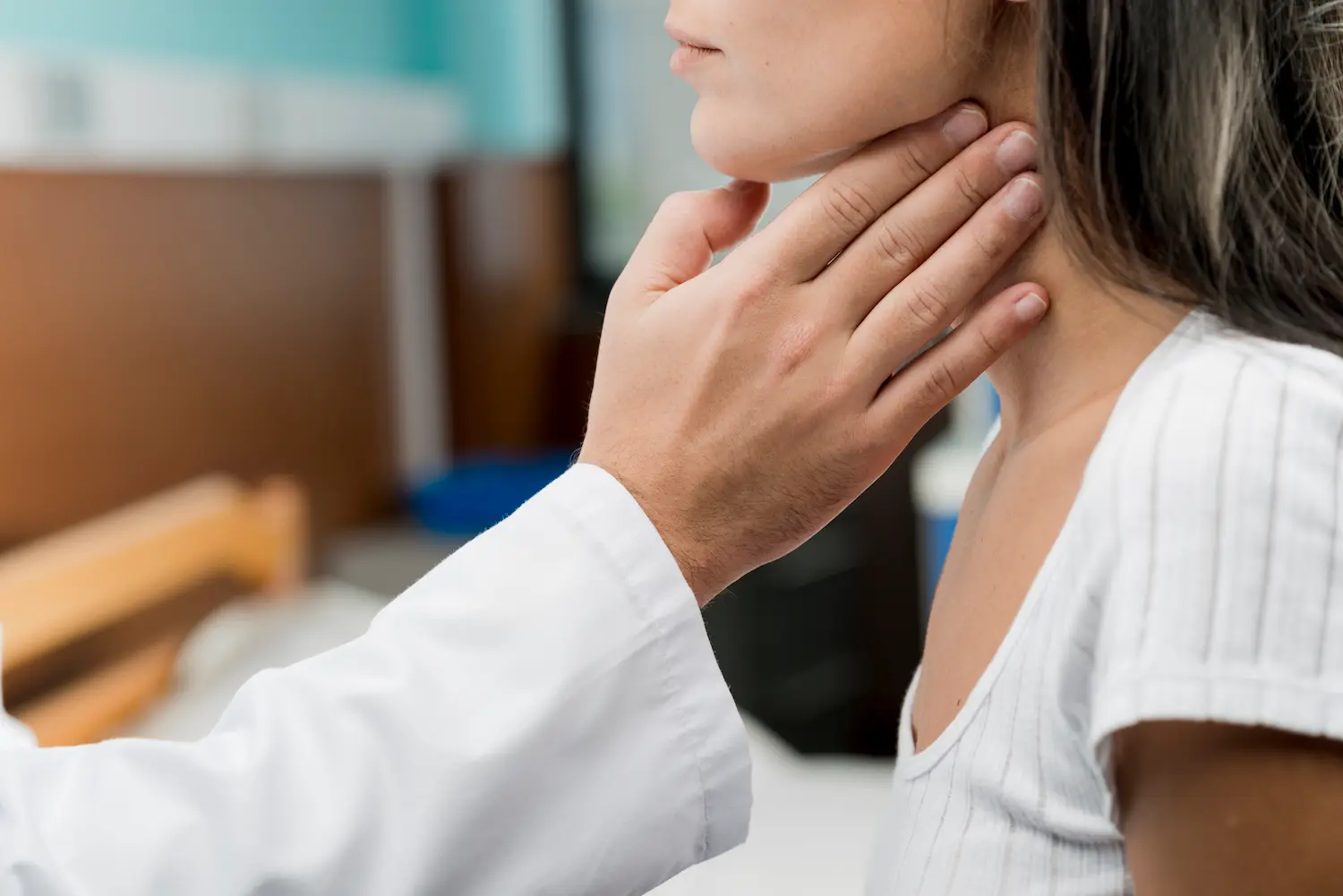 a doctor examining constant phlegm in throat