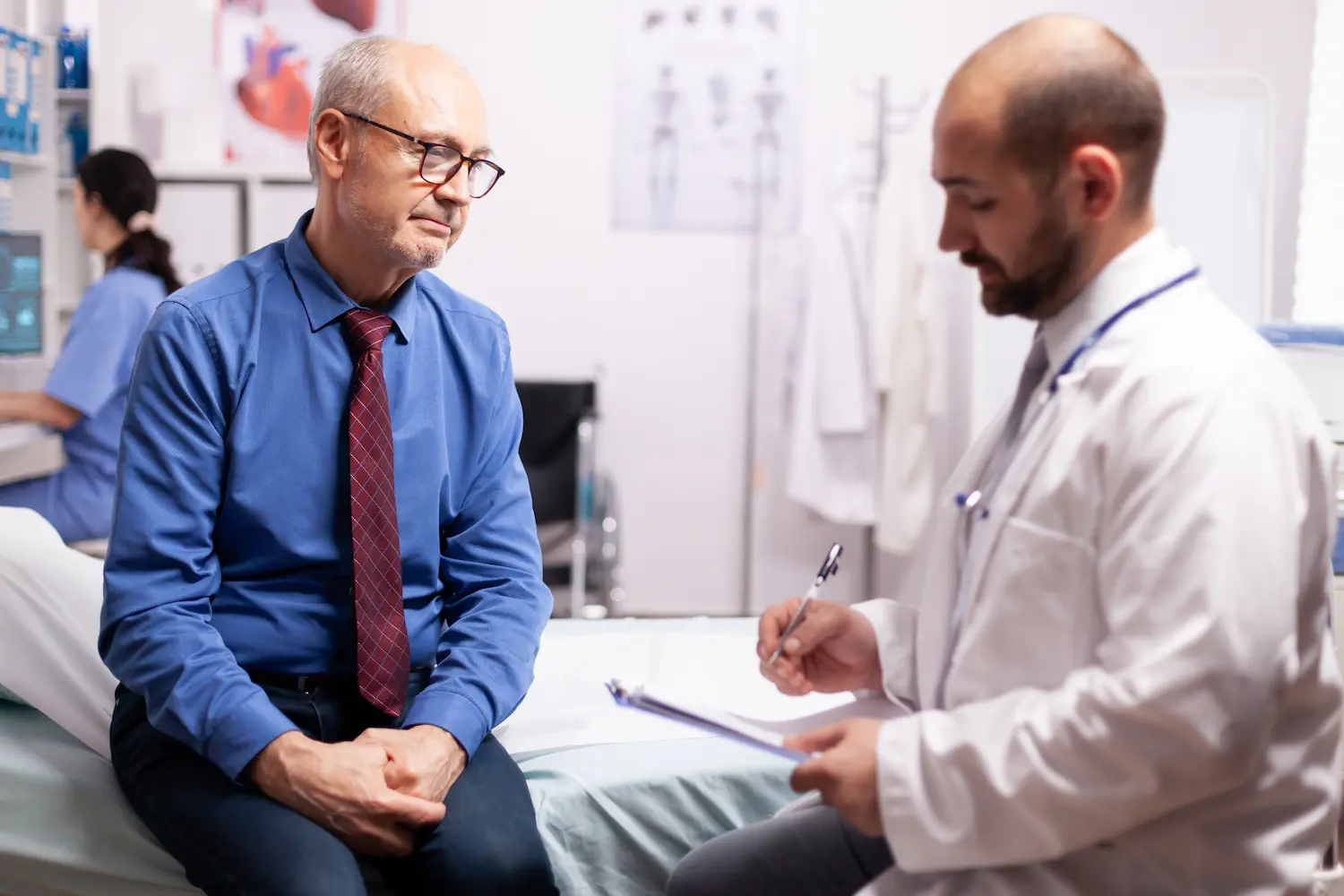 a doctor explaining to a patient what is a dangerous psa level by age