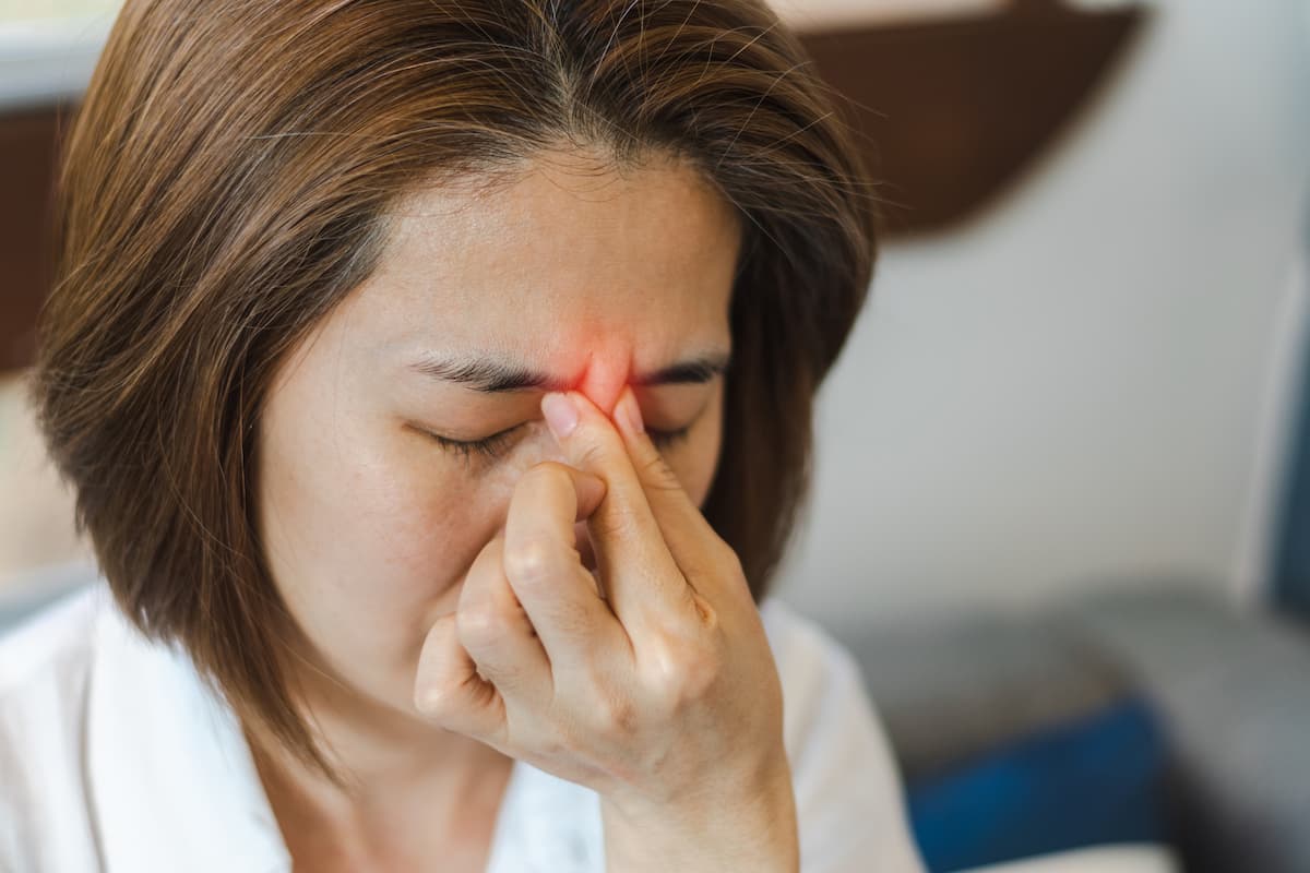 a woman with symptoms of pansinusitis