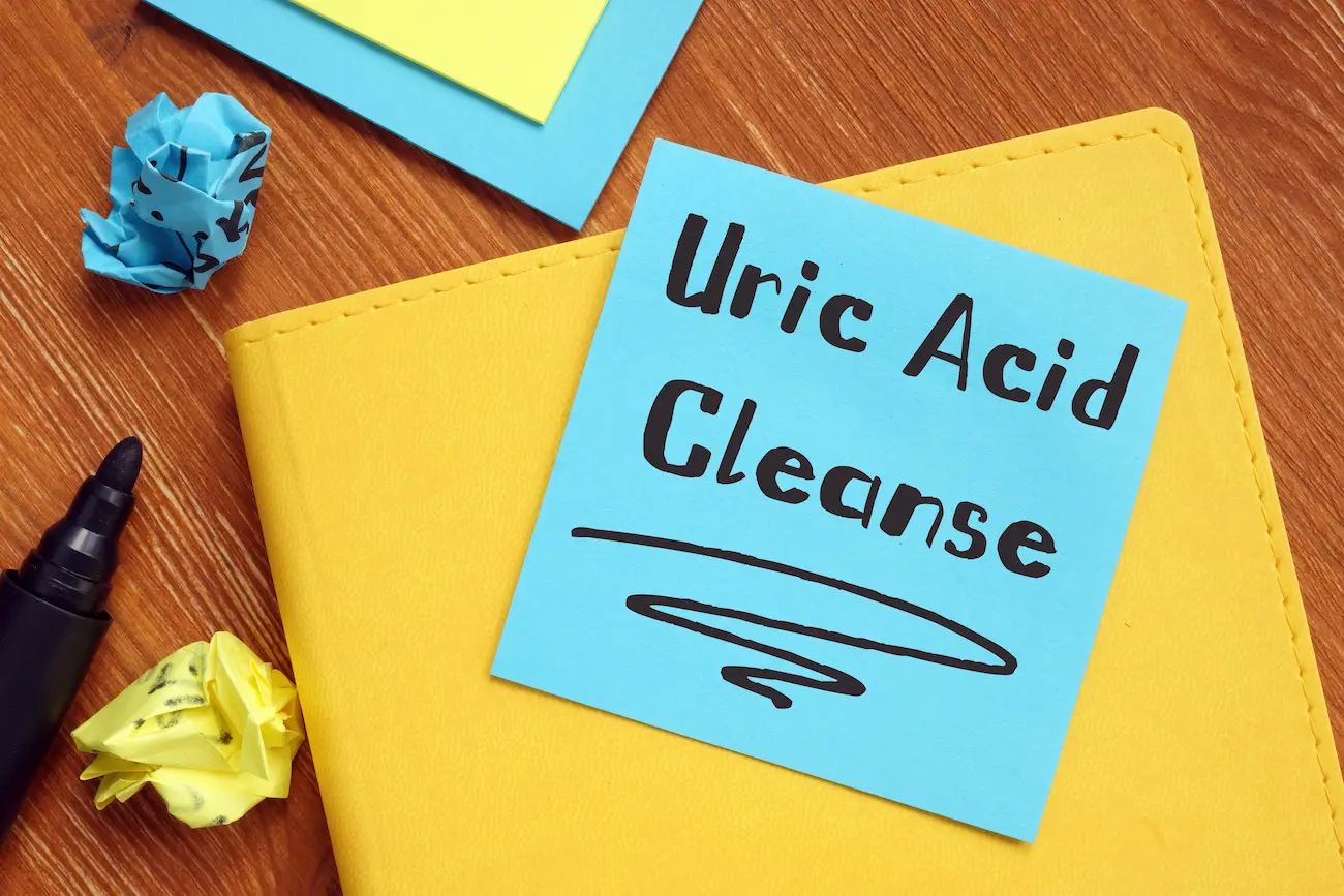 a post it note with uric acid cleanse on it