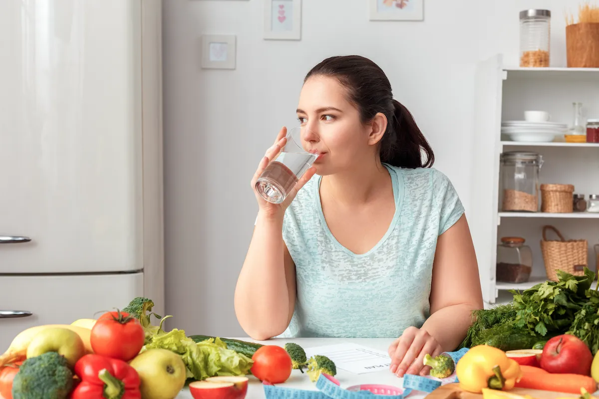 A woman wondering does drinking water lower blood sugar