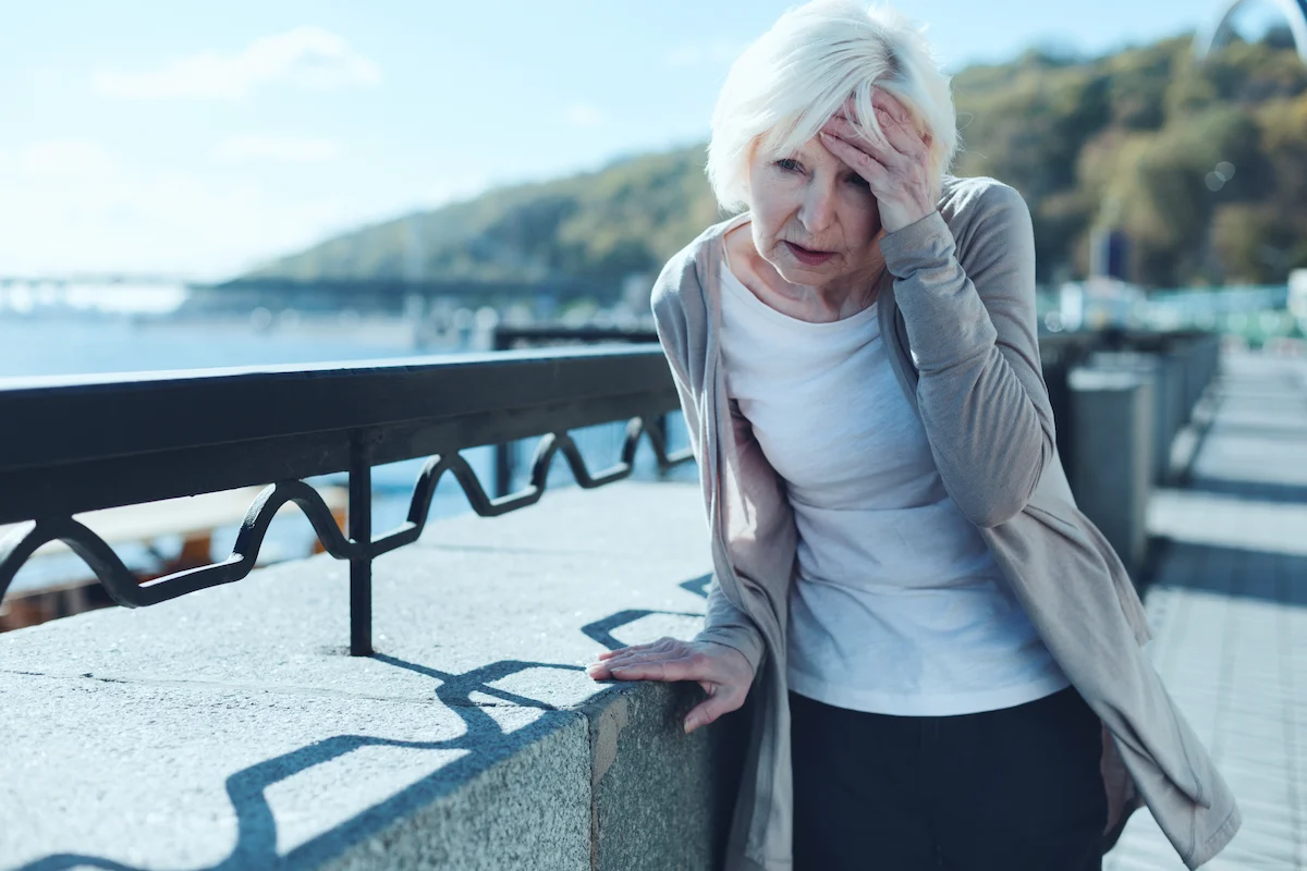 An elderly woman wondering what causes vertigo in elderly