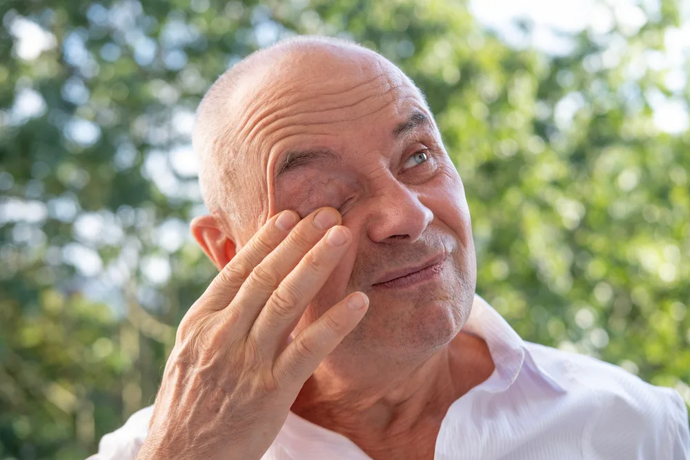 A man wondering how to relieve eye pressure at home