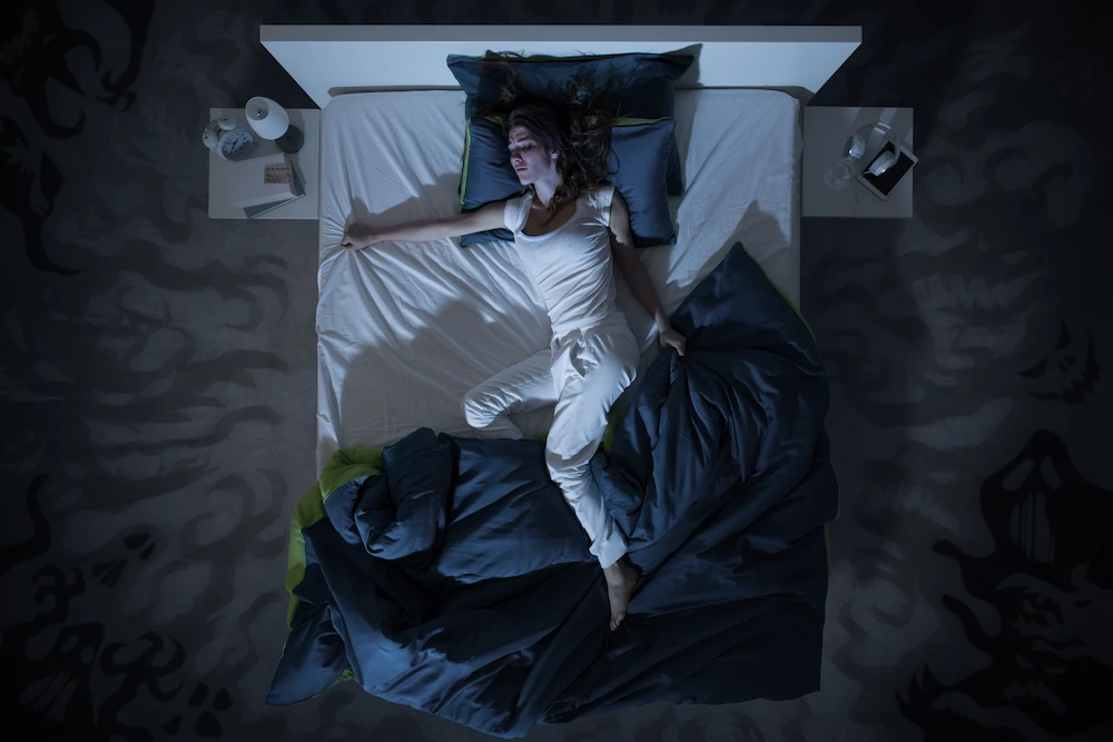 A woman with night sweats during period